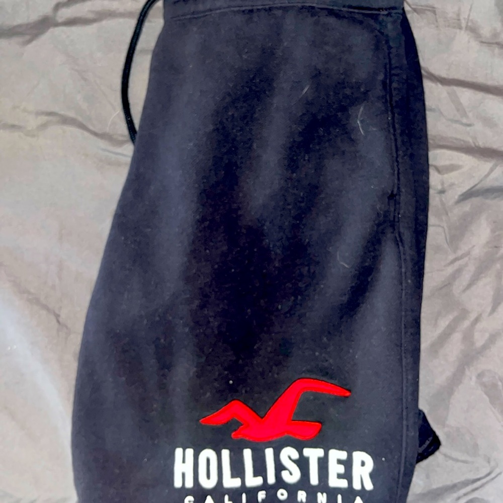 A pair of Hollister cloth shorts that are black/red  size L in adult men’s.